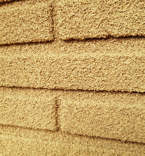 Fassadenschutz mit KliuCork® Deutschland Sprühkork – nachhaltige Korkbeschichtung als langlebige Korkfarbe für Außenwände.